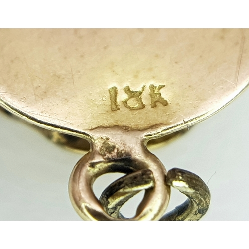 1053 - An 18K Gold Atocha Pendant. 2cm. 3g.