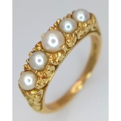 1088 - AN 18K GOLD RING IN CLASSIC STYLE WITH 5 PEARLS SET TO TOP. 5.4g. Size O.