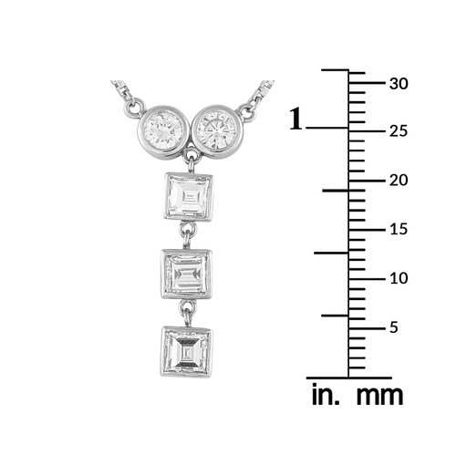 1009 - A Platinum 1.41ct Diamond Necklace. Two bezel-set round diamonds side by side, a vertical drop of th... 