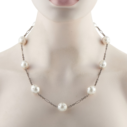 1023 - A 14K White Gold 4.46ct Diamond and Pearl Necklace. An intricate 14K White Gold chain measuring 21 i... 
