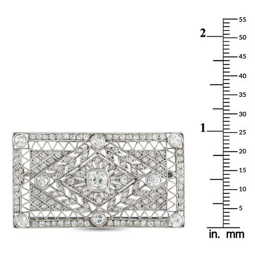 1055 - A Platinum 3.0ct Diamond Brooch. With an intricate openwork design, this luxury brooch draws inspira... 