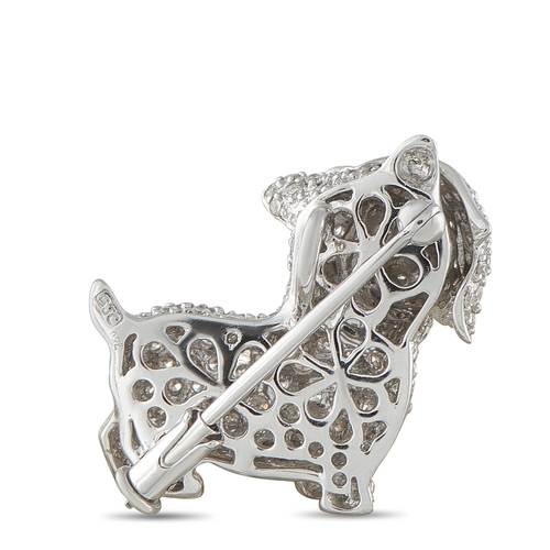 1069 - An 18K White Gold 1.25ct Diamond Dog Brooch. Touches of gold contrast beautifully against the 18K Wh... 