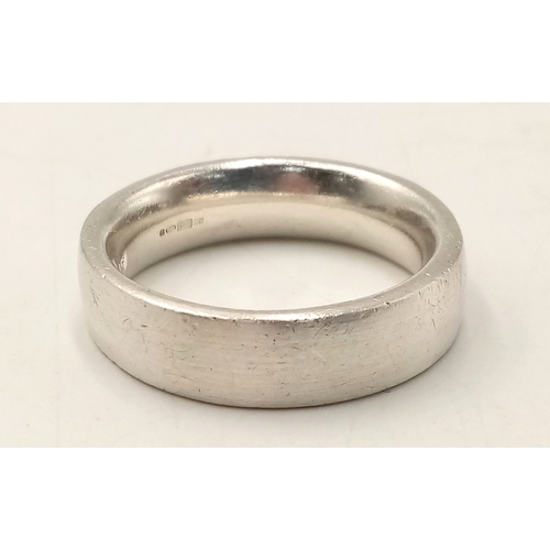 1070 - A Heavyweight Vintage Hallmarked Sterling Silver Band Ring Size X. Measures 7mm Wide and weighs 12.8... 