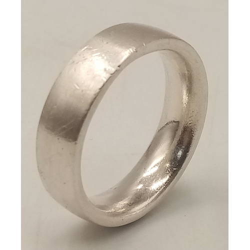 1070 - A Heavyweight Vintage Hallmarked Sterling Silver Band Ring Size X. Measures 7mm Wide and weighs 12.8... 