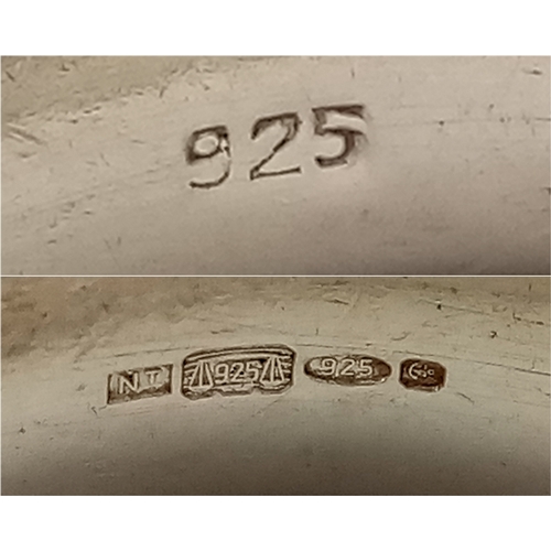 1070 - A Heavyweight Vintage Hallmarked Sterling Silver Band Ring Size X. Measures 7mm Wide and weighs 12.8... 