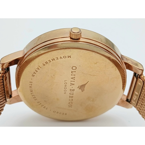 1127 - AN OLIVIA BURTON, ROSE GOLD TONE, MESH BRACELET WATCH WITH FLORAL DIAL. IN FULL WORKING ORDER. S/A 1... 