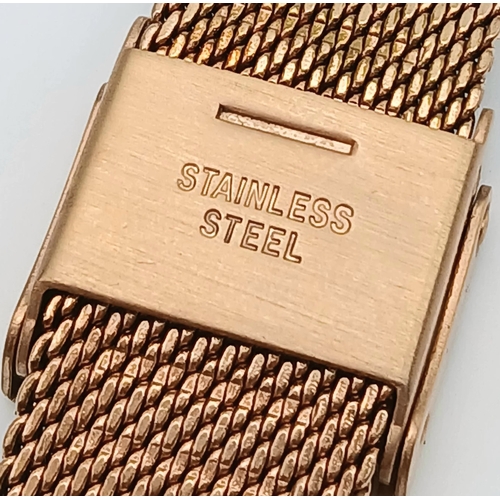 1127 - AN OLIVIA BURTON, ROSE GOLD TONE, MESH BRACELET WATCH WITH FLORAL DIAL. IN FULL WORKING ORDER. S/A 1... 