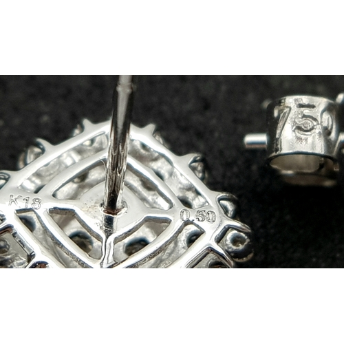 519 - A Pair of 18K White Gold and Diamond Cluster Earrings. c0.50ctw diamonds. 9 x 9mm. 2.21g total weigh... 