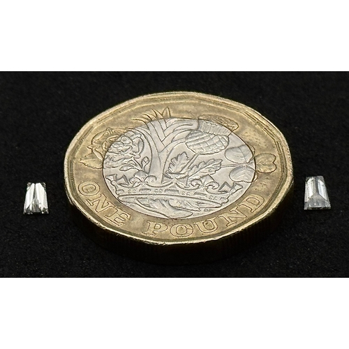 545 - A PAIR OF TAPERING BAGUETTE NATURAL DIAMONDS. 0.275TCW. ABSC 1006