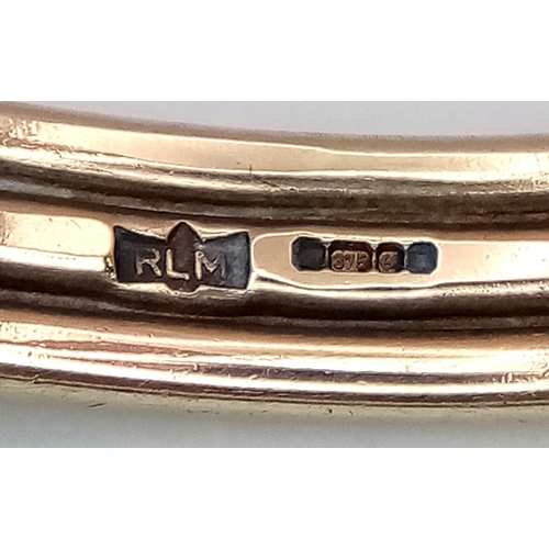 1108 - A 9K Yellow Gold Swirl Cuff Bangle. 22.65g.