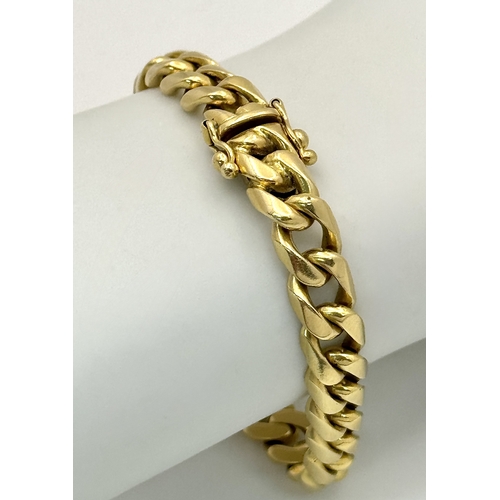 515 - A TIFFANY AND CO 18K GOLD CURB LINK BRACELET WITH BOX CLASP .          40gms        19cms