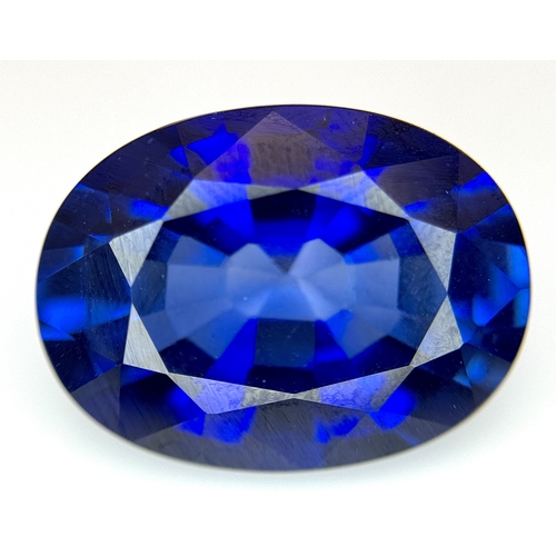 1115 - A W.G.I Certified Lab Grown 24.24ct Sapphire. Oval mixed cut.