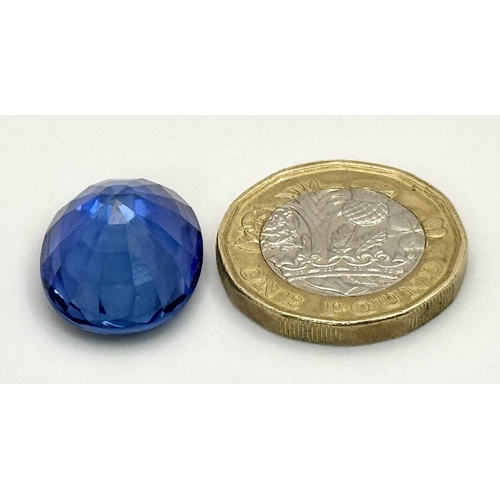 1115 - A W.G.I Certified Lab Grown 24.24ct Sapphire. Oval mixed cut.