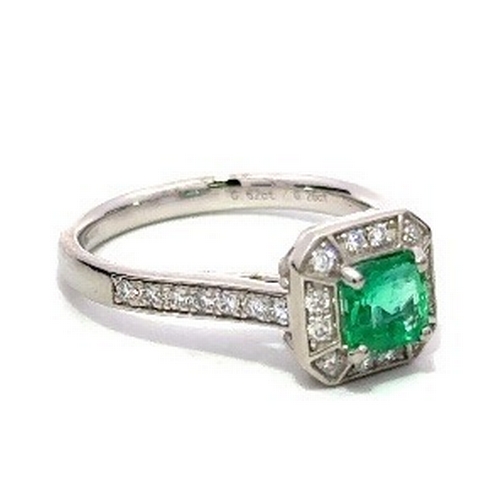 1013 - A Platinum natural Colombian Emerald and Diamond Ring. Emerald - 0.62ct. Diamond - 0.26ctw. Size L. ... 