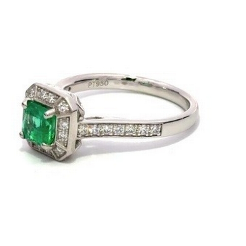 1013 - A Platinum natural Colombian Emerald and Diamond Ring. Emerald - 0.62ct. Diamond - 0.26ctw. Size L. ... 
