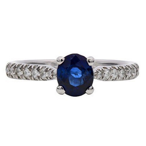 1104 - A Head-Turning Platinum, Sapphire and Diamond Dress Ring. 0.87ct sapphire with 0.23ctw of diamond ac... 