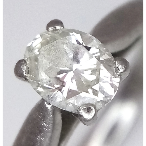 544 - A 950 Platinum, Diamond Solitaire Ring. 0.55ct oval cut diamond. SL2 clarity. Slight colour tint. Si... 