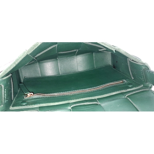 551 - A Bottega Veneta Green Intrecciato Leather Shoulder Bag. Green leather exterior with a gold-toned ha... 