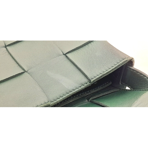 551 - A Bottega Veneta Green Intrecciato Leather Shoulder Bag. Green leather exterior with a gold-toned ha... 