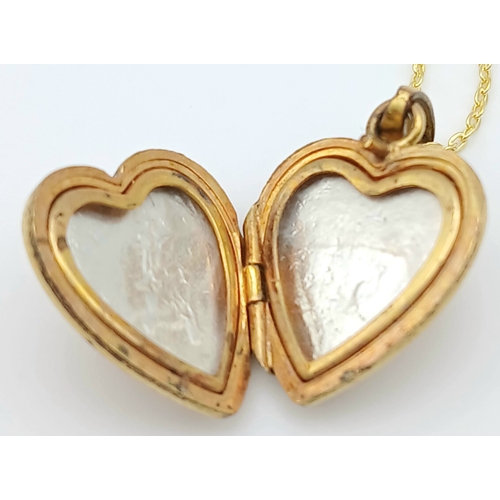 1007 - A Vintage Rolled Gold Heart Locket Pendant on a later 46cm Gold Gilded Sterling Silver Chain. The Lo... 
