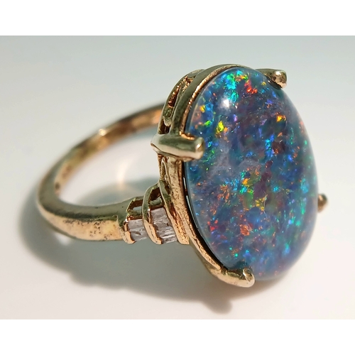 1021 - An Eye-Catching Gold Gilded Opal Set Ring Size M1/2. Set with a 1.8cm Length Opal. Gross weight 4.89... 