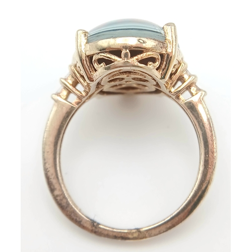 1021 - An Eye-Catching Gold Gilded Opal Set Ring Size M1/2. Set with a 1.8cm Length Opal. Gross weight 4.89... 