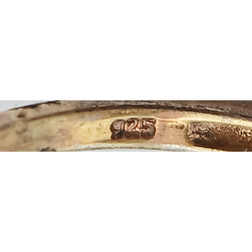 1021 - An Eye-Catching Gold Gilded Opal Set Ring Size M1/2. Set with a 1.8cm Length Opal. Gross weight 4.89... 