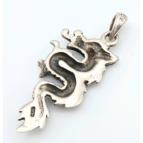 1029 - A STERLING SILVER, DRAGON PENDANT. SYBOLIZING STRENGTH AND POWER. 6.5G. A/S RED 6