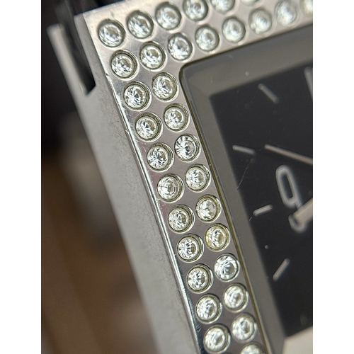 1064 - A DKNY, STONE SET, SQUARE FACE, BLACK LEATHER STRAP WATCH. WITH ORIGINAL STRAP AND BUCKLE. IN FULL W... 