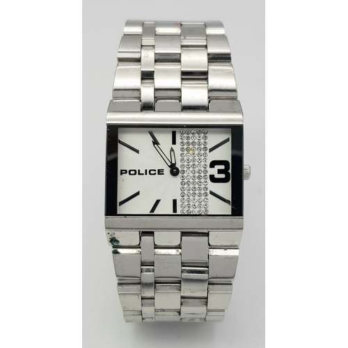 1078 - A POLICE, CRYSTAL SET WHITE DIAL, ON A STEEL BRICK LINK BRACELET. IN FULL WORKING ORDER. NEW BATTERY... 