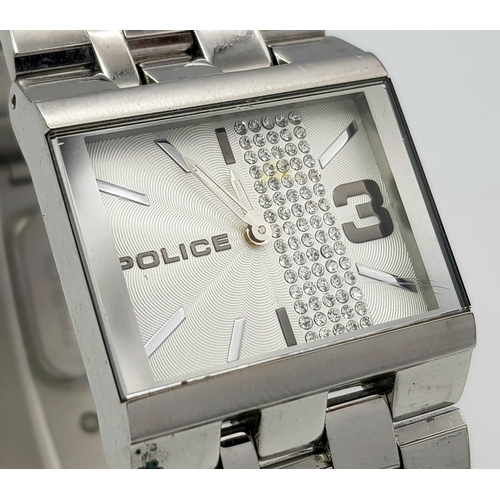 1078 - A POLICE, CRYSTAL SET WHITE DIAL, ON A STEEL BRICK LINK BRACELET. IN FULL WORKING ORDER. NEW BATTERY... 