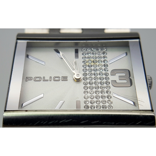 1078 - A POLICE, CRYSTAL SET WHITE DIAL, ON A STEEL BRICK LINK BRACELET. IN FULL WORKING ORDER. NEW BATTERY... 