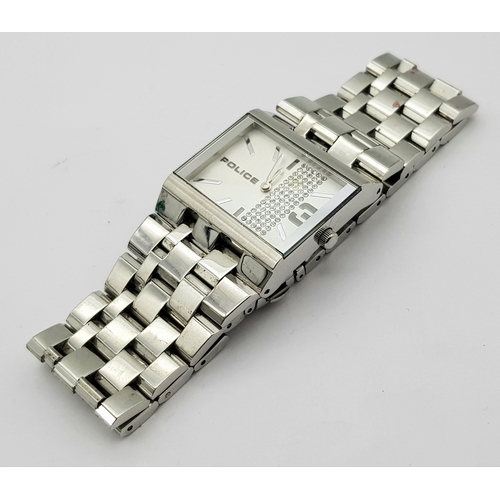 1078 - A POLICE, CRYSTAL SET WHITE DIAL, ON A STEEL BRICK LINK BRACELET. IN FULL WORKING ORDER. NEW BATTERY... 