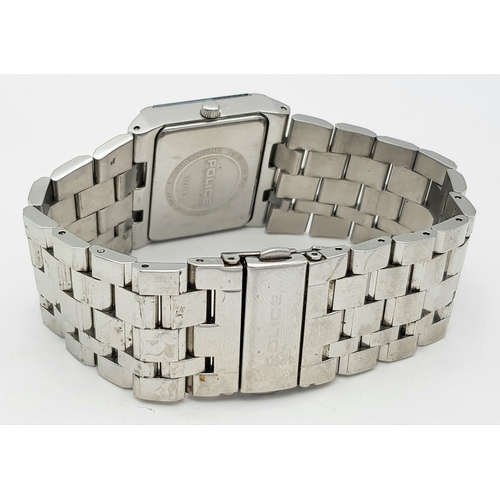 1078 - A POLICE, CRYSTAL SET WHITE DIAL, ON A STEEL BRICK LINK BRACELET. IN FULL WORKING ORDER. NEW BATTERY... 