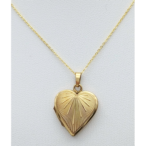 1105 - An Antique Rolled Gold Heart Locket Pendant on a later Gold Gilded Sterling Silver 46cm Length Chain... 