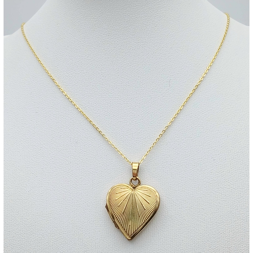 1105 - An Antique Rolled Gold Heart Locket Pendant on a later Gold Gilded Sterling Silver 46cm Length Chain... 