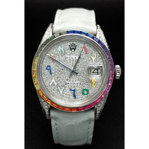 A Customized Rolex Datejust Diamond Automatic Watch. White leather strap. Stainless steel diamond encrusted side case -36mm and lugs. Diamond encrusted dial. Colourful channel set gemstone bezel. Note: The diamonds and gemstones have been professionally custom fitted. In working order.
