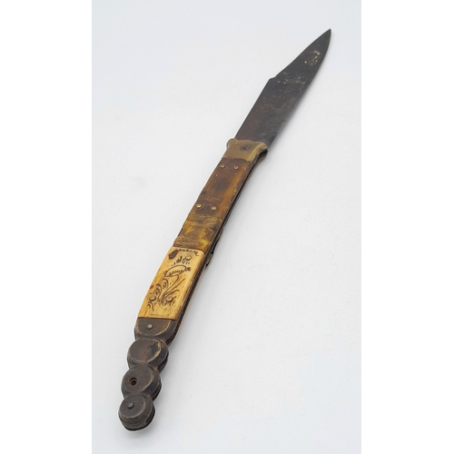 1143 - An Antique Spanish Folding Knife. Wood and brass handle with decorative inlaid horn. 35cm total leng... 