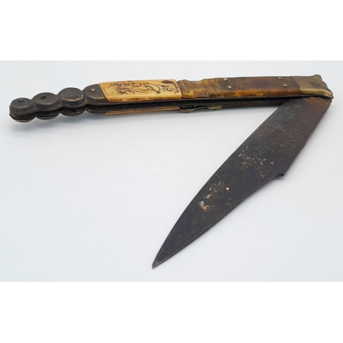 1143 - An Antique Spanish Folding Knife. Wood and brass handle with decorative inlaid horn. 35cm total leng... 