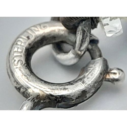 1114 - A black and clear faceted bead necklace with 925 silver clasp.
Approx 40cm length. Please see photos... 