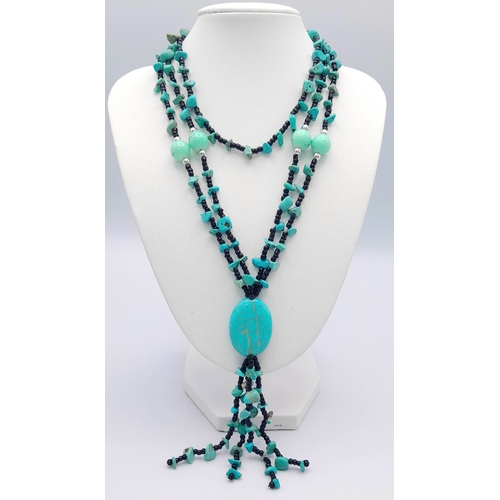 1093 - A pretty turquoise bead necklace. 
Comprising multiple strands of small black beads with turquoise c... 