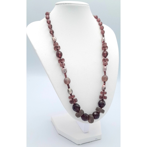 1107 - A purple and brown mixed stone bead necklace with 925 silver clasp. Approx 49cm length. Please see p... 