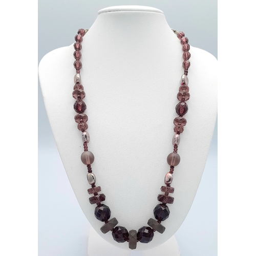 1107 - A purple and brown mixed stone bead necklace with 925 silver clasp. Approx 49cm length. Please see p... 