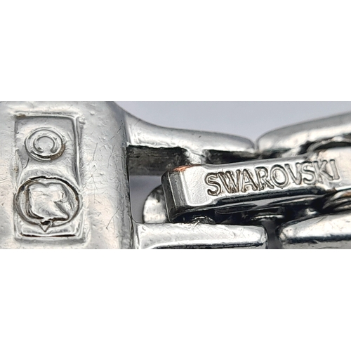 1120 - A SWAROVSKI, SILVER TONE, CRYSTAL SET BUTTERFLY RING. IN SIZE 52 / K/L. WITH A SWAROVSKI, SILVER TON... 