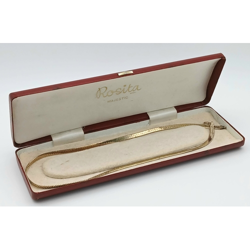 1079 - A 925 Italy silver necklace.
Comprising a flat herringbone style chain with textured finish and lobs... 