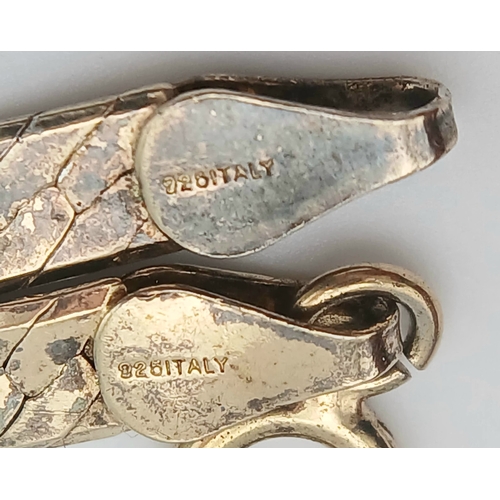 1079 - A 925 Italy silver necklace.
Comprising a flat herringbone style chain with textured finish and lobs... 