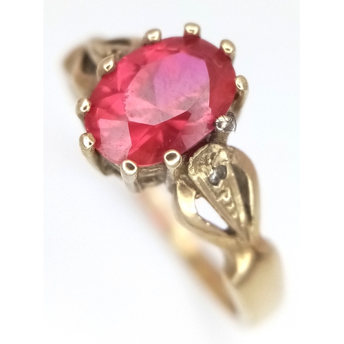 155 - A 9K Yellow Gold Garnet Solitaire Ring. Oval cut. Size P. 2.65g