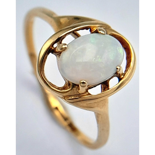 365 - A 9K Yellow Gold Opal Solitaire Ring. Cabochon stone with good colour play. Size J 1/2. 1.4g.