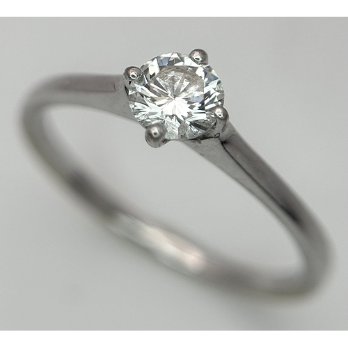 384 - An 18K White Gold Diamond Solitaire Ring. 0.31ct round brilliant cut diamond with E colour and VS1 c... 