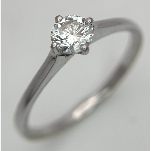 384 - An 18K White Gold Diamond Solitaire Ring. 0.31ct round brilliant cut diamond with E colour and VS1 c... 